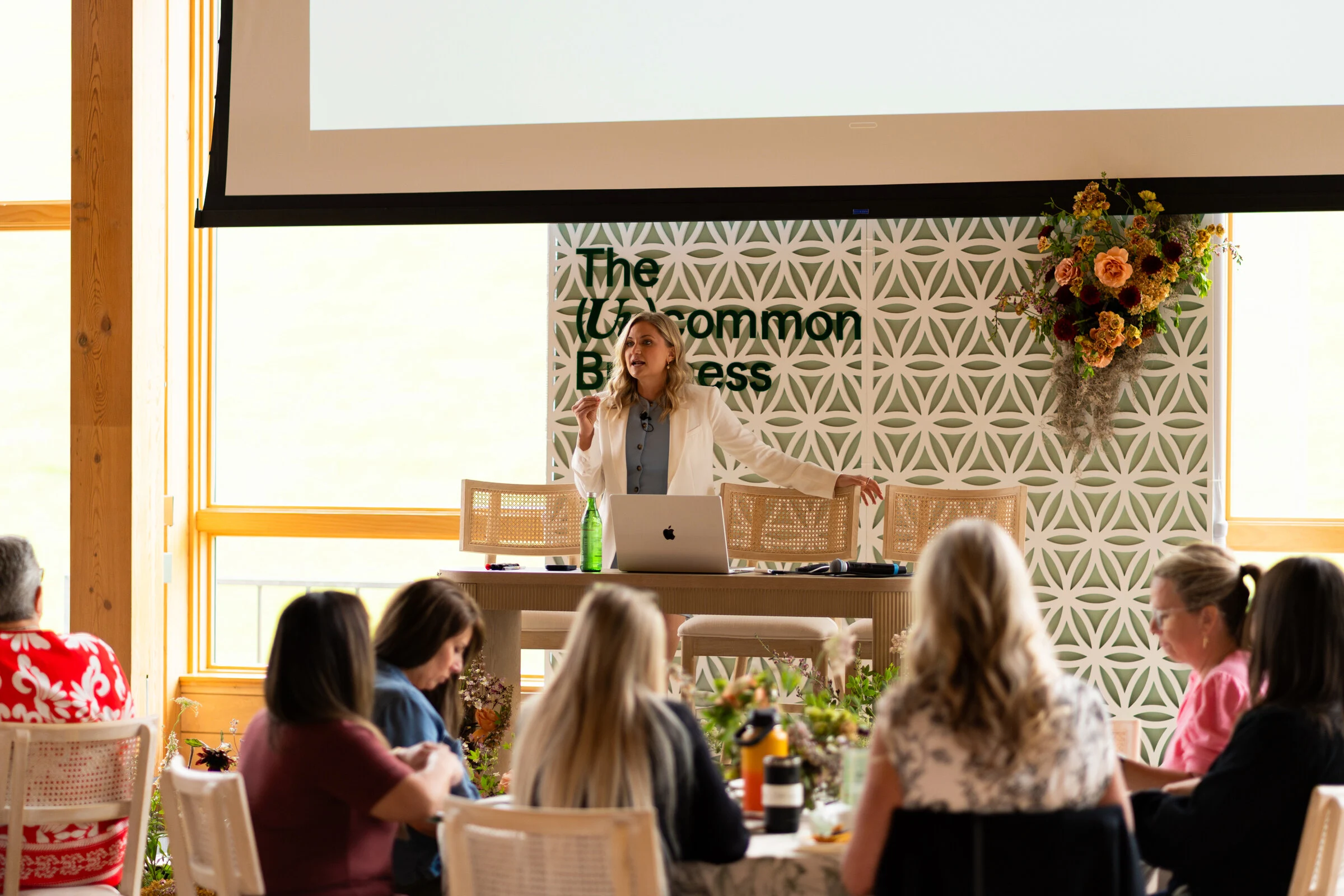 A speaker presenting onstage at an Uncommon Business event
